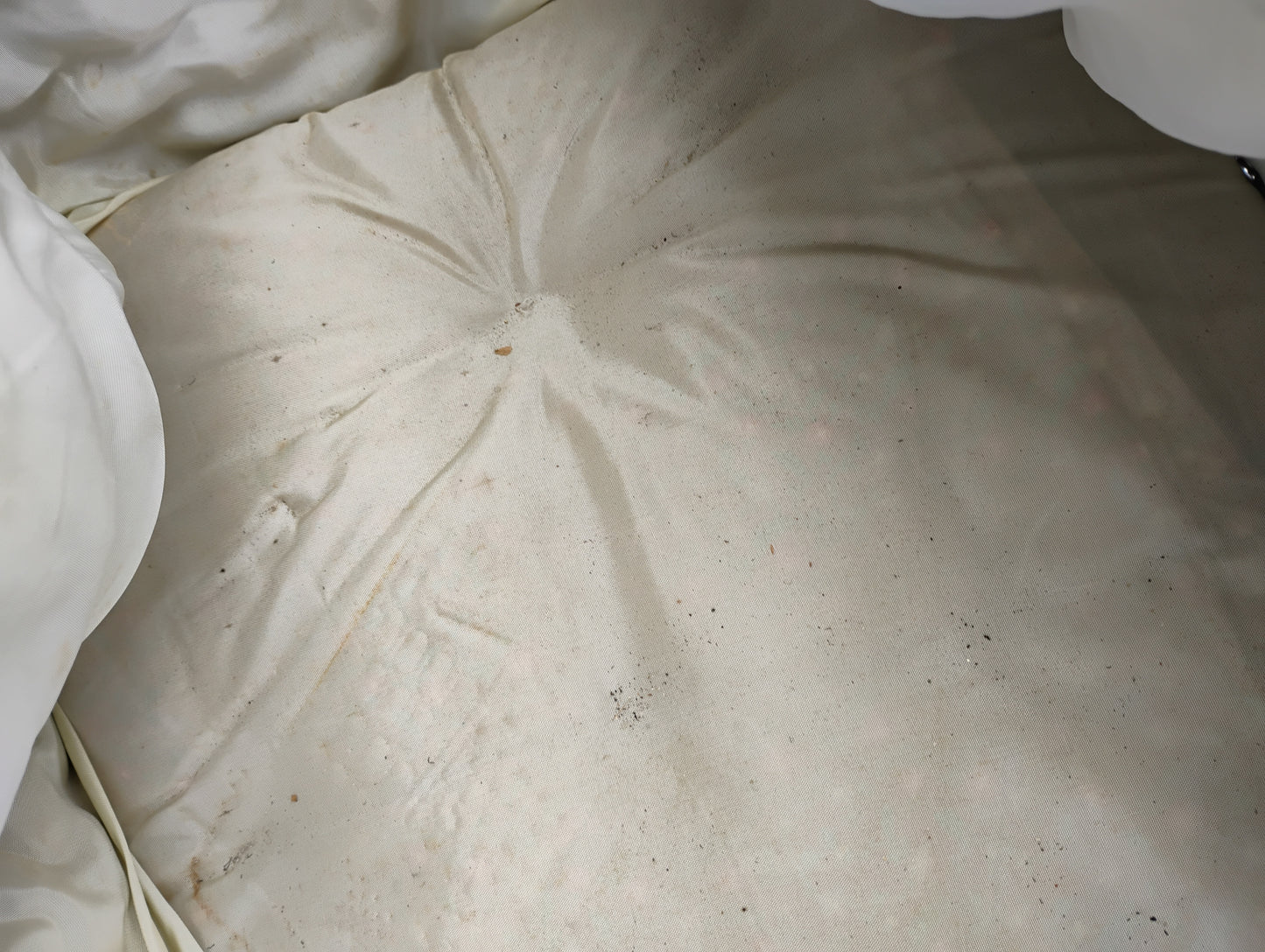 close up of antique baby buggy bedding