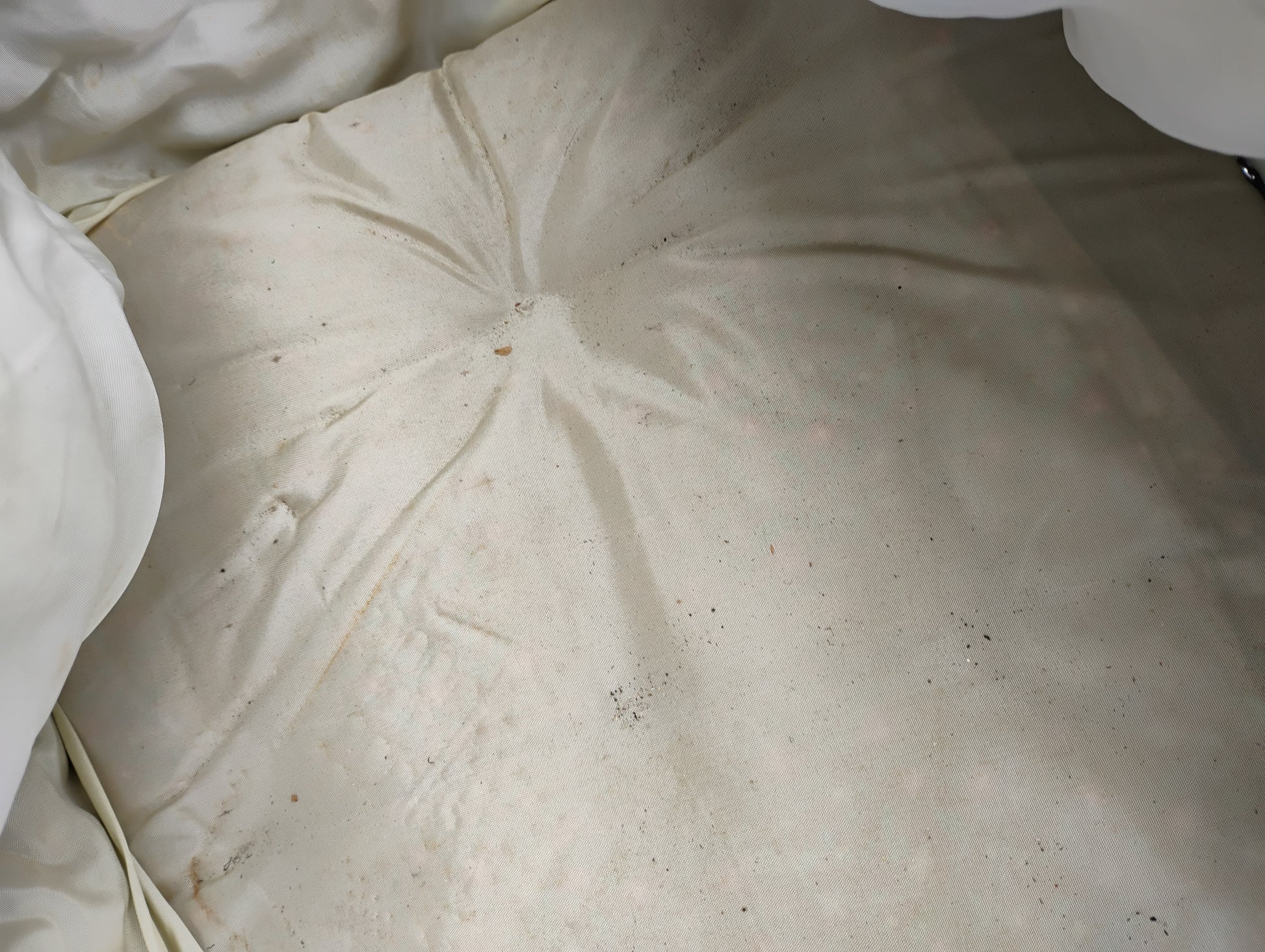 close up of antique baby buggy bedding